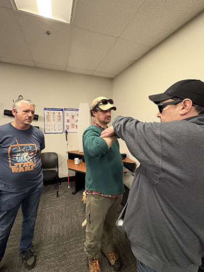 2 students practicing self defense techniques