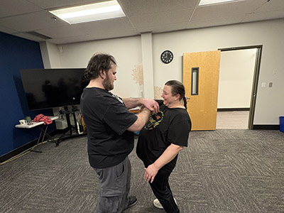 2 students practicing self defense techniques